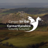 Carmarthenshire Council logo with landscape in background