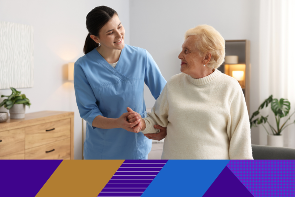 carer holding hands with older lady